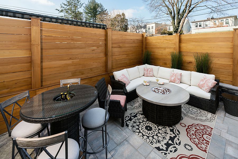 Small urban patio still fits lounging and bar top dining.